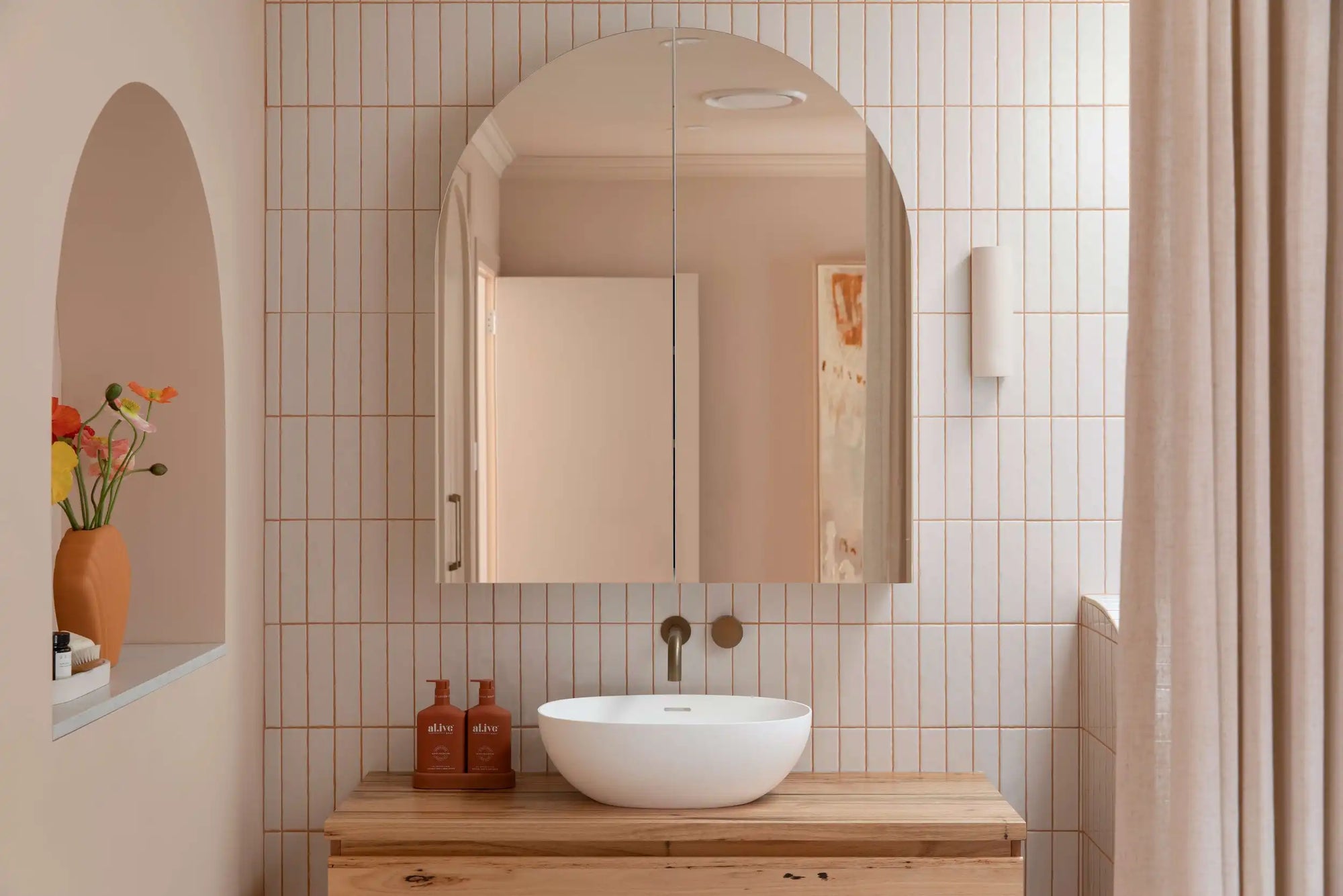 Modern arched bathroom wall cabinets with mirrors above wooden vanity
