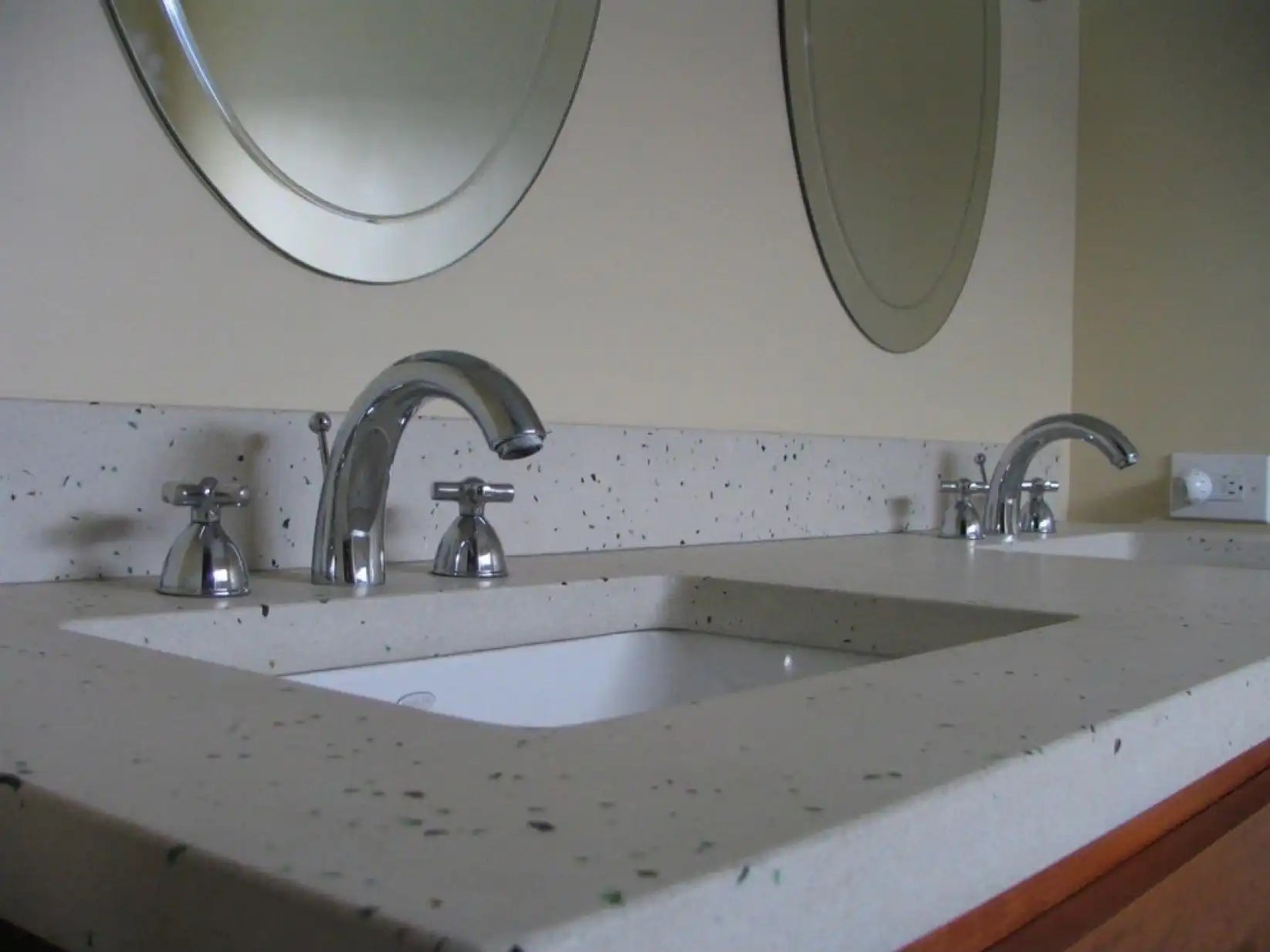 A modern double-sink vanity with sleek chrome faucets, showcasing a clean countertop design that fits the standard sink size perfectly. | ACE DECOR