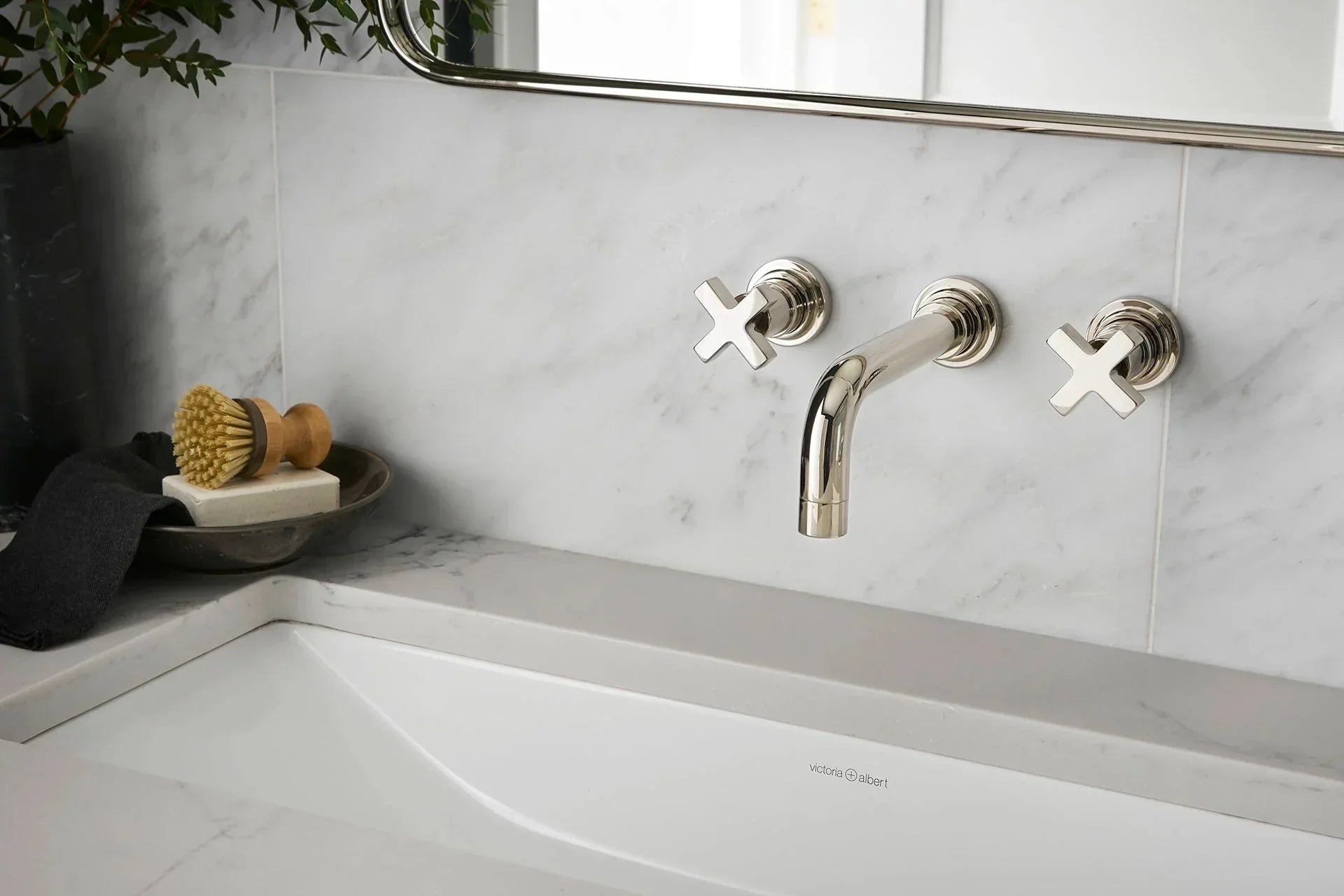 This image shows a sleek, modern bathroom sink with polished bathroom vanity faucets 3 hole mounted on a marble backsplash. | ACE DECOR