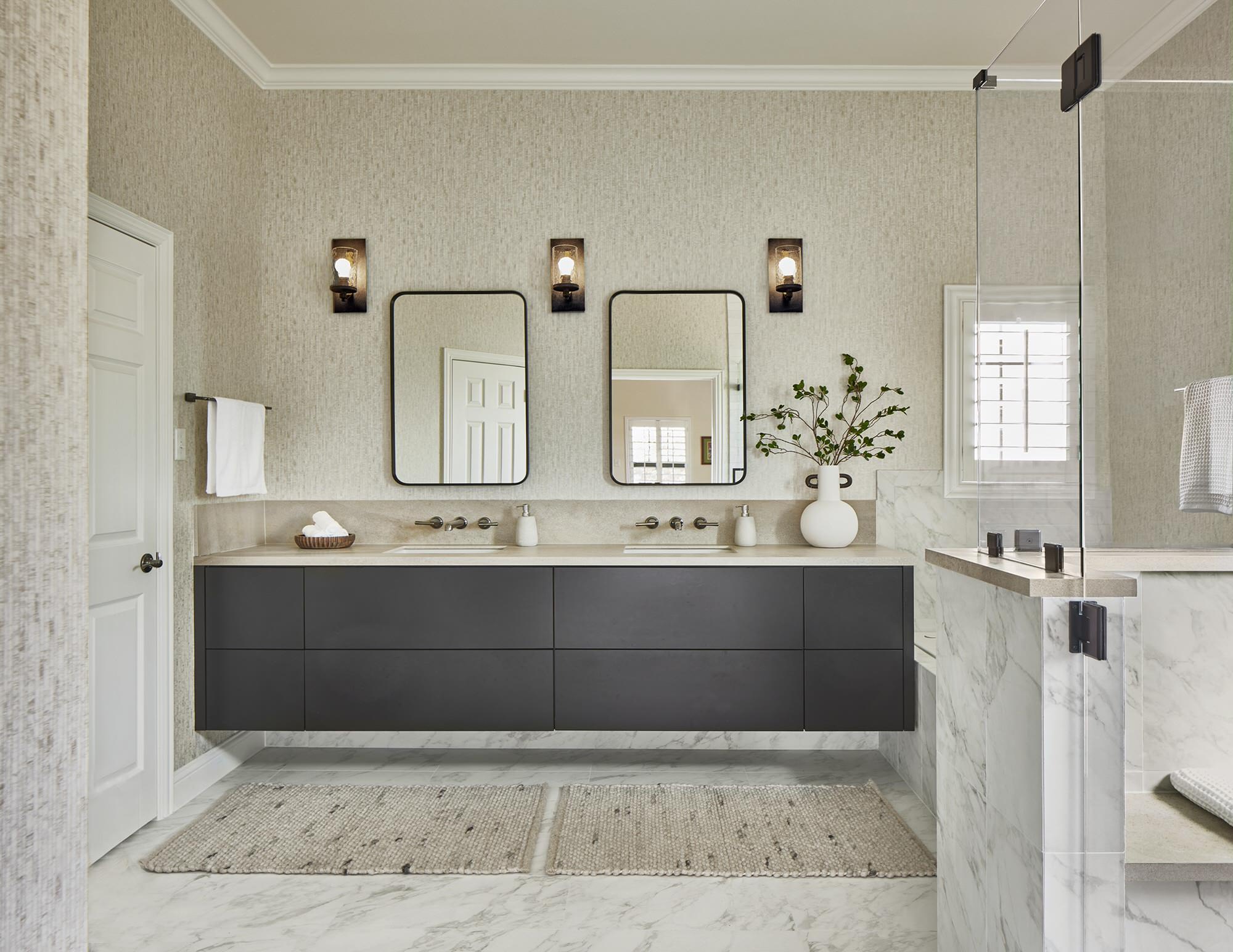 A modern bathroom featuring a sleek double-sink floating vanity, minimalist mirrors, and soft neutral tones for a calm, elegant aesthetic. | ACE DECOR