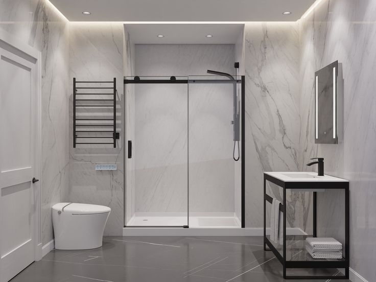 Modern bathroom with black hardware after installing a frameless shower door with sliding design