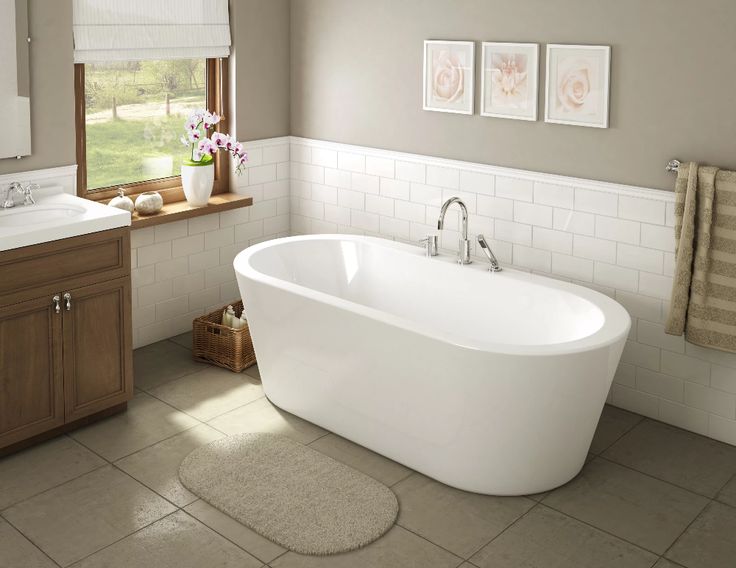 Cozy traditional bathroom highlighting classic freestanding bathtub sizes with timeless curved edges.
