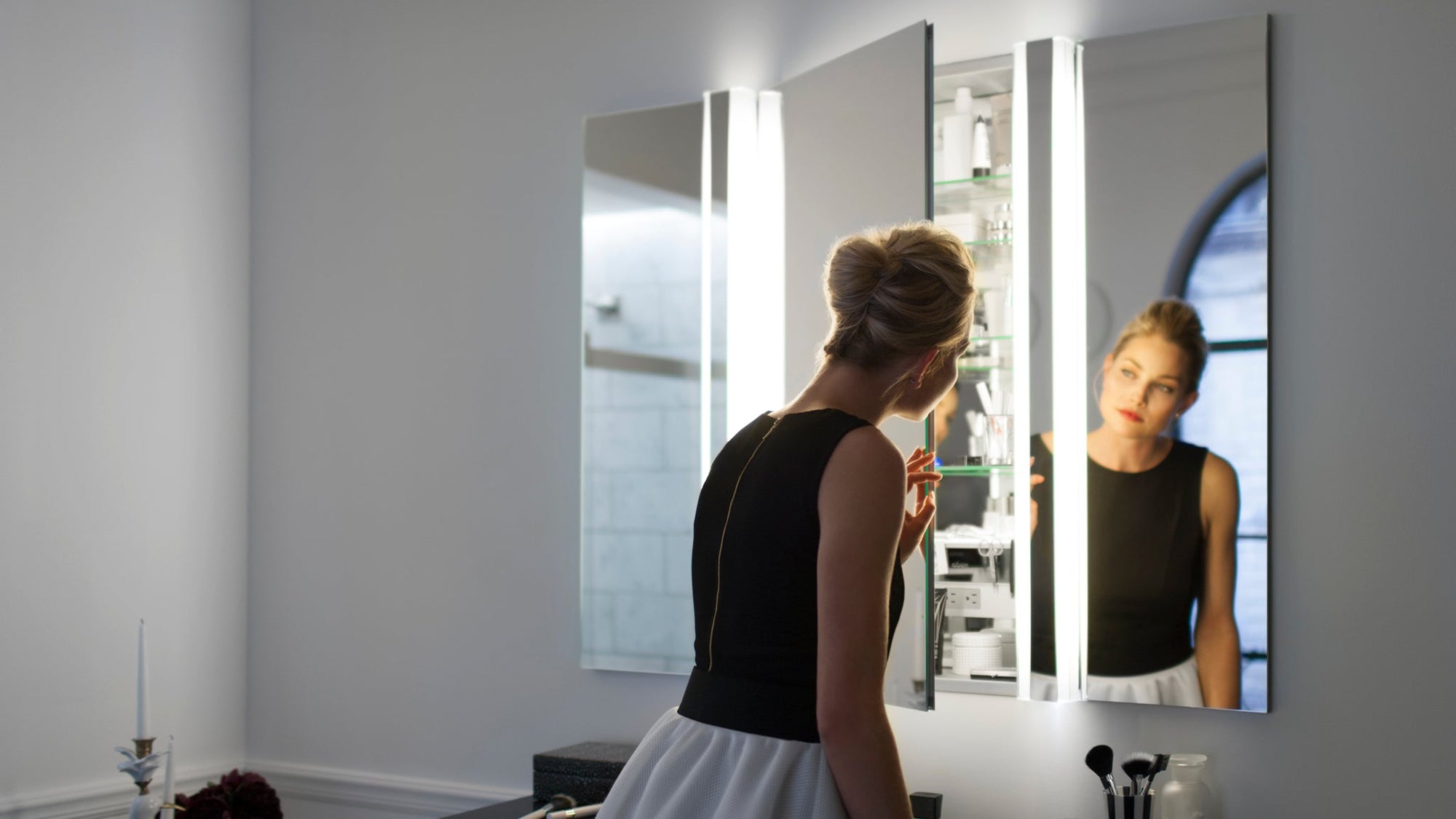 LED-lit mirror door for medicine cabinet with built-in shelves and modern design