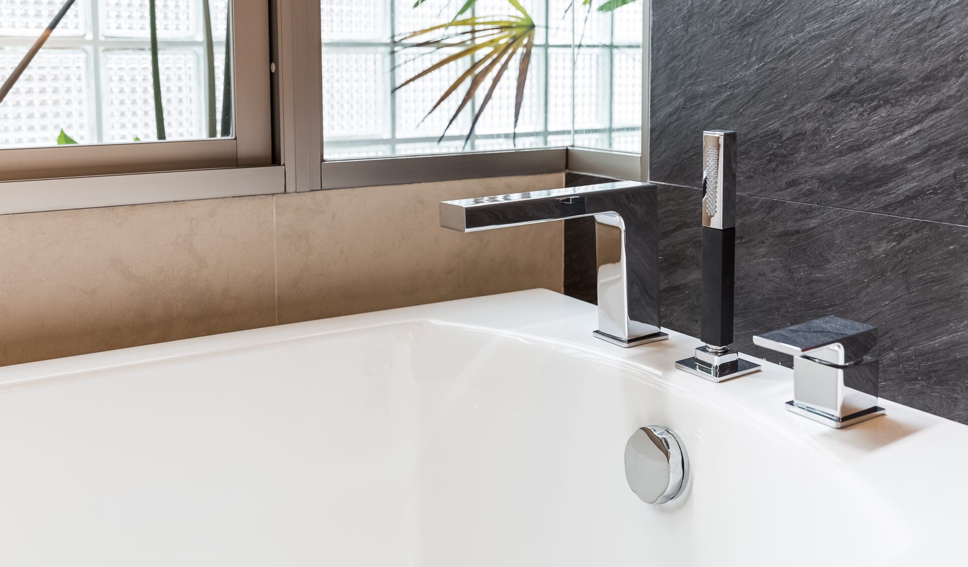 Modern chrome bathtub faucet with space for installing a bathtub faucet aerator
