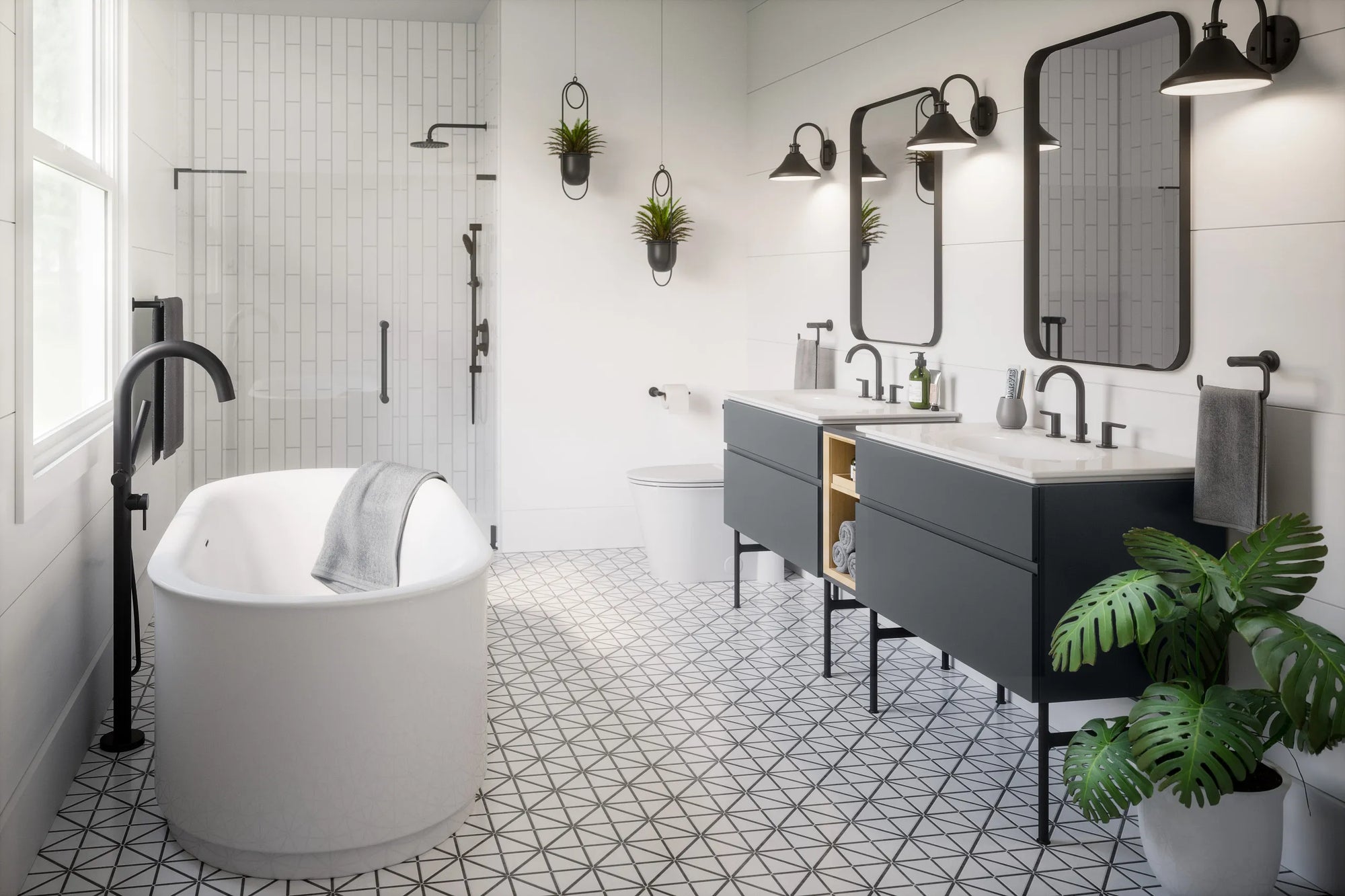 Modern bathroom with freestanding bathtub, geometric tile floor, double-sink vanity, and tankless smart toilet. Features black fixtures and greenery.