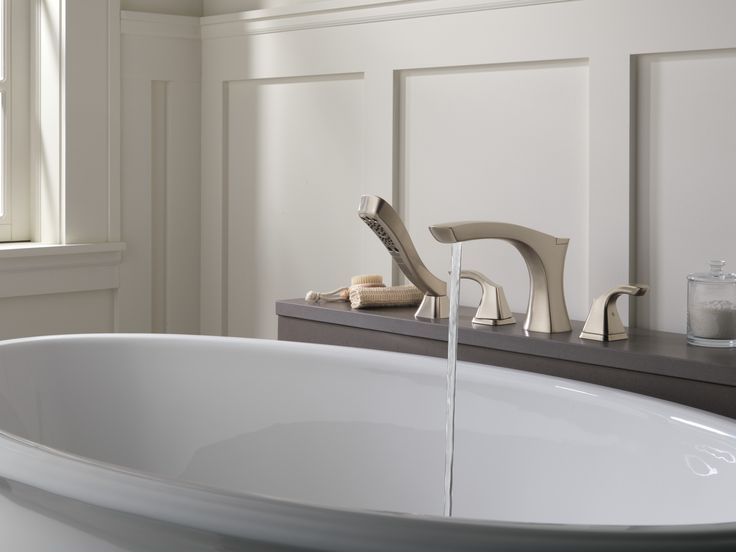 Brushed nickel bathtub shower faucet with handheld shower, deck-mounted for an elegant bathroom design