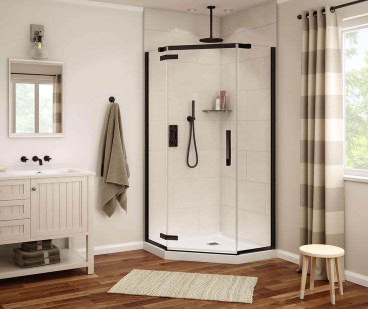 Neo-angle corner shower enclosure with black hardware and glass doors in a cozy bathroom with wood flooring