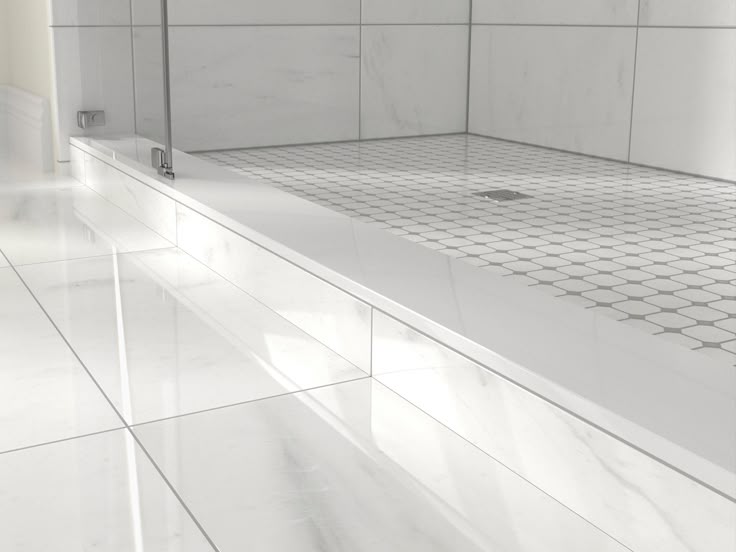 Modern shower base replacement with a white marble curb and hexagonal tile flooring