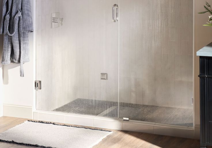 Contemporary walk-in shower featuring a best steam shower system with subtle steam flow