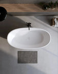 Overhead view of the Abyss Series freestanding soaking tub in a modern bathroom.