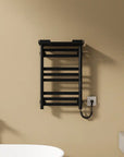 Matte black Thervon Series towel warmer nearby bathtub, 18 x 27 wall-mounted design for modern bathrooms | Ace Decor