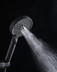 Auralen Series matte black handheld shower head with a powerful, targeted spray.