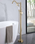 Brushed Gold Freestanding Tub Faucet with Handheld Shower Installed Beside Modern Freestanding White Bathtub.