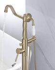 Brushed Gold Freestanding Tub Faucet with Handheld Shower — Side View of Floor Mount Bathtub Filler in Use with Running Water.