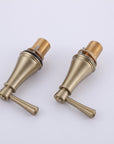 VALMIRA brushed gold sink faucet handles with hot and cold water indicators.