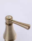 VALMIRA Brushed gold sink faucet handle with blue dot.
