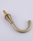 VALMIRA Brushed gold sink faucet with curved spout and threaded base.