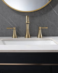 VALMIRA brushed gold sink faucet on white marble countertop.