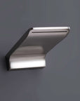 Sleek waterfall tub spout on the Brushed Nickel Shower System