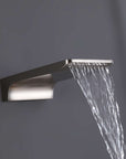 Brushed nickel waterfall tub spout releasing a smooth, steady water stream