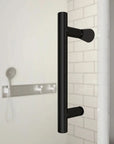 Matte black handle detail of semi-frameless pivot shower door | Ace Decor