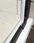 Bottom waterproof seal detail of matte black semi-frameless pivot shower door | Ace Decor