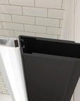 Aluminum frame detail of matte black semi-frameless pivot shower door | Ace Decor