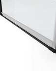 Close-up of Zerra Series matte black pivot shower door bottom seal and threshold.