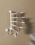 White Orven Series towel rack heater 16 x 27 with multiple towels hanging on rotating bars | Ace Decor