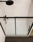 Top view of Brivio sliding shower door with concealed shower system and shower base.