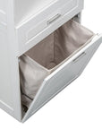Close-up of tilt-out laundry basket on tall white bathroom linen cabinet, designed for convenient clothes storage.