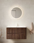 Ravello Series Wall-Mounted Vanity in modern bathroom setting with backlit round mirror.