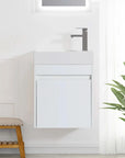 18" white bathroom sink with vanity shown wall-mounted in a bright modern bathroom | Ace Decor