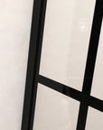 Close-up frame detail of fixed shower door panel 34 x 72 inch black finish | Ace Decor