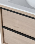 24" bathroom wall mount vanity drawer detail in light oak with black handle accents | Ace Decor