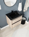 24" wall mounted bathroom vanity angled view with black ceramic sink and light oak cabinet | Ace Decor
