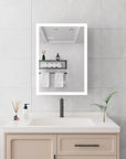 Calvante 28 inch LED mirror cabinet with time function above vanity sink.