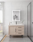 Modern bathroom interior with Calvante 28 inch LED mirror cabinet above vanity sink.