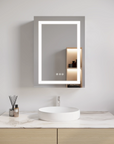 Wall-mounted Hawley 26 inch LED light mirror bathroom cabinet above white sink.