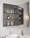 Hawley 26 inch LED light mirror bathroom cabinet with door open, showing interior glass shelves storing toiletries and cosmetics.