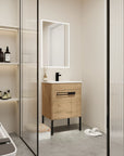 24" freestanding bathroom vanity with sink styled in a modern bathroom setting for space-saving design | Ace Decor