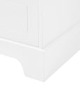 Close-up of sturdy cabinet base and foot design on tall white bathroom linen cabinet.