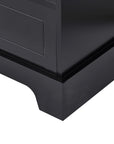 Focused view of base and foot design on tall black linen cabinet, emphasizing stable structure.