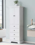 Tall white bathroom linen cabinet with doors and drawers in a modern bathroom setting.