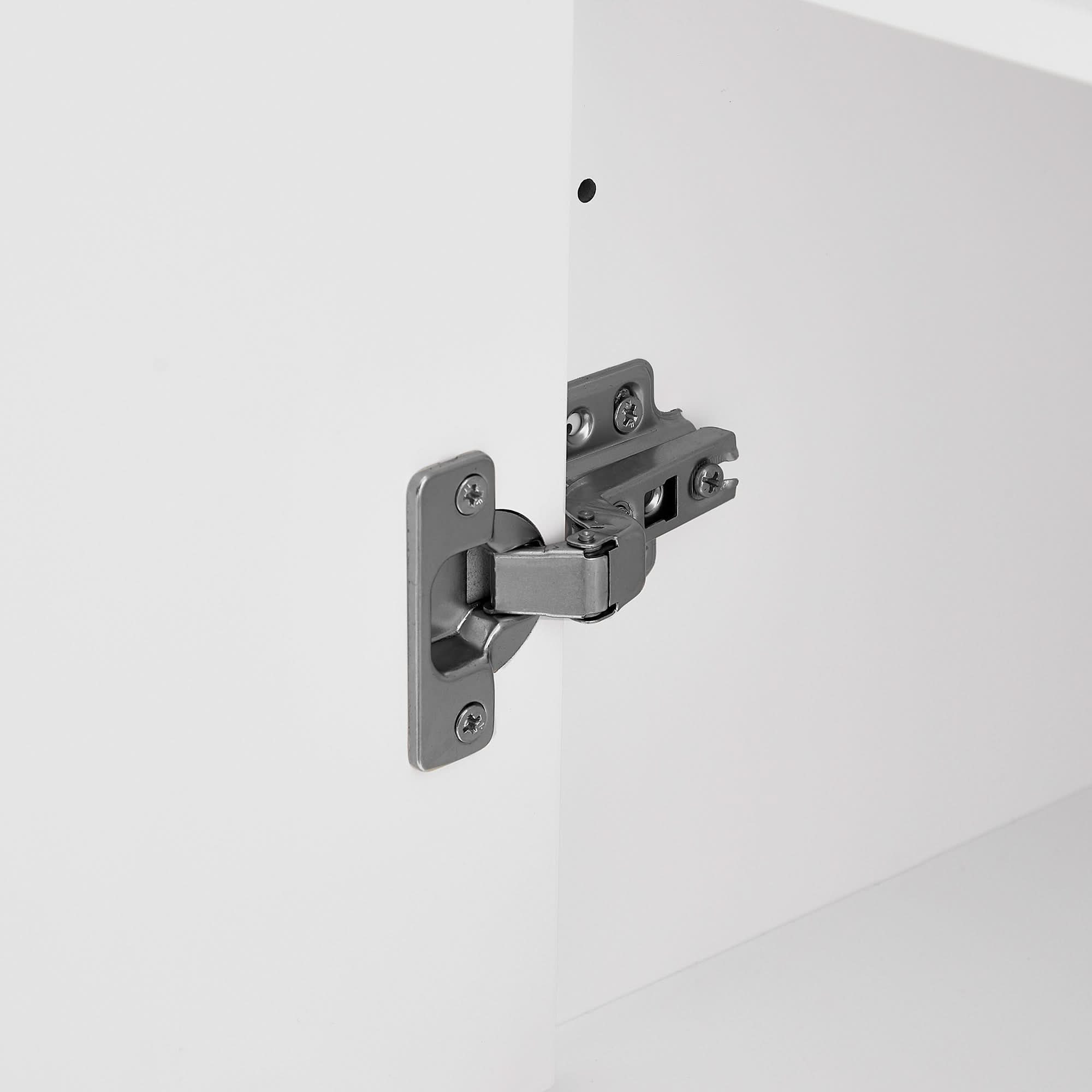 Close-up of the high quality metal hinge of the bathroom storage cabinet.