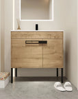 36" freestanding 36 inch bathroom vanity in modern bathroom setting with mirror, wood-tone cabinet, and metal legs | Ace Decor