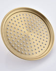 Avelar 9-inch brushed gold rain shower head with soft rubber spray holes for easy cleaning.