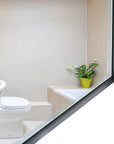Noir Series black metal frame bathroom mirror on white background, highlighting its metal fram and beveled glass edge detail.