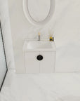 24 inch floating bathroom vanity with black handle in a modern bathroom | Ace Decor
