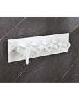 Wall-mounted installation of Cascade Shower System control panel in white.